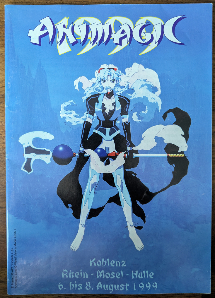 cover of the convention guide of the first big anime convention in germany: Animagic 1999. It features an image from the Anime El Hazard on a light blue background.