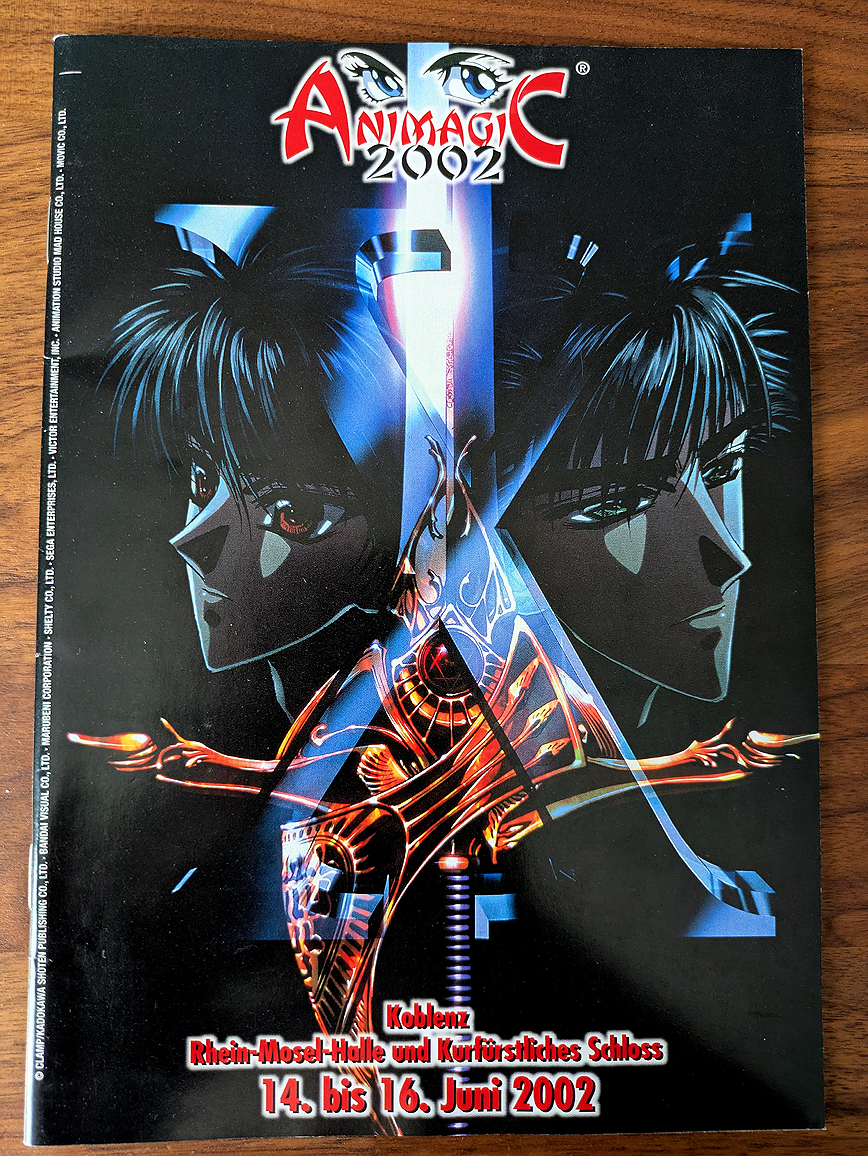 cover of the convention guide of a big anime convention in germany: Animagic from June 2002. It features an image from the Anime X (original Manga by Clamp.
