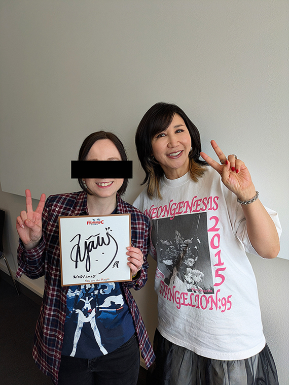 Yoko Takahashi and me holding the autograph