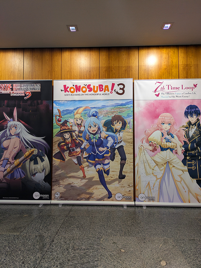 walls lined with poster for anime like Kono Suba