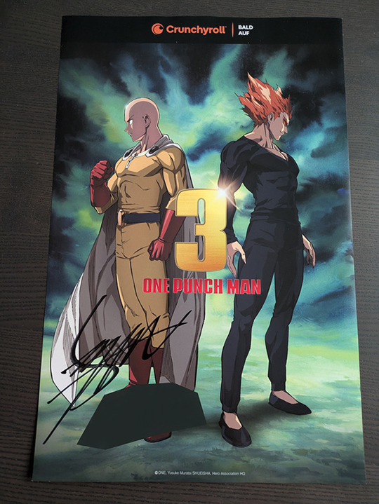 photo of a signed poster from the third season of One Punch Man